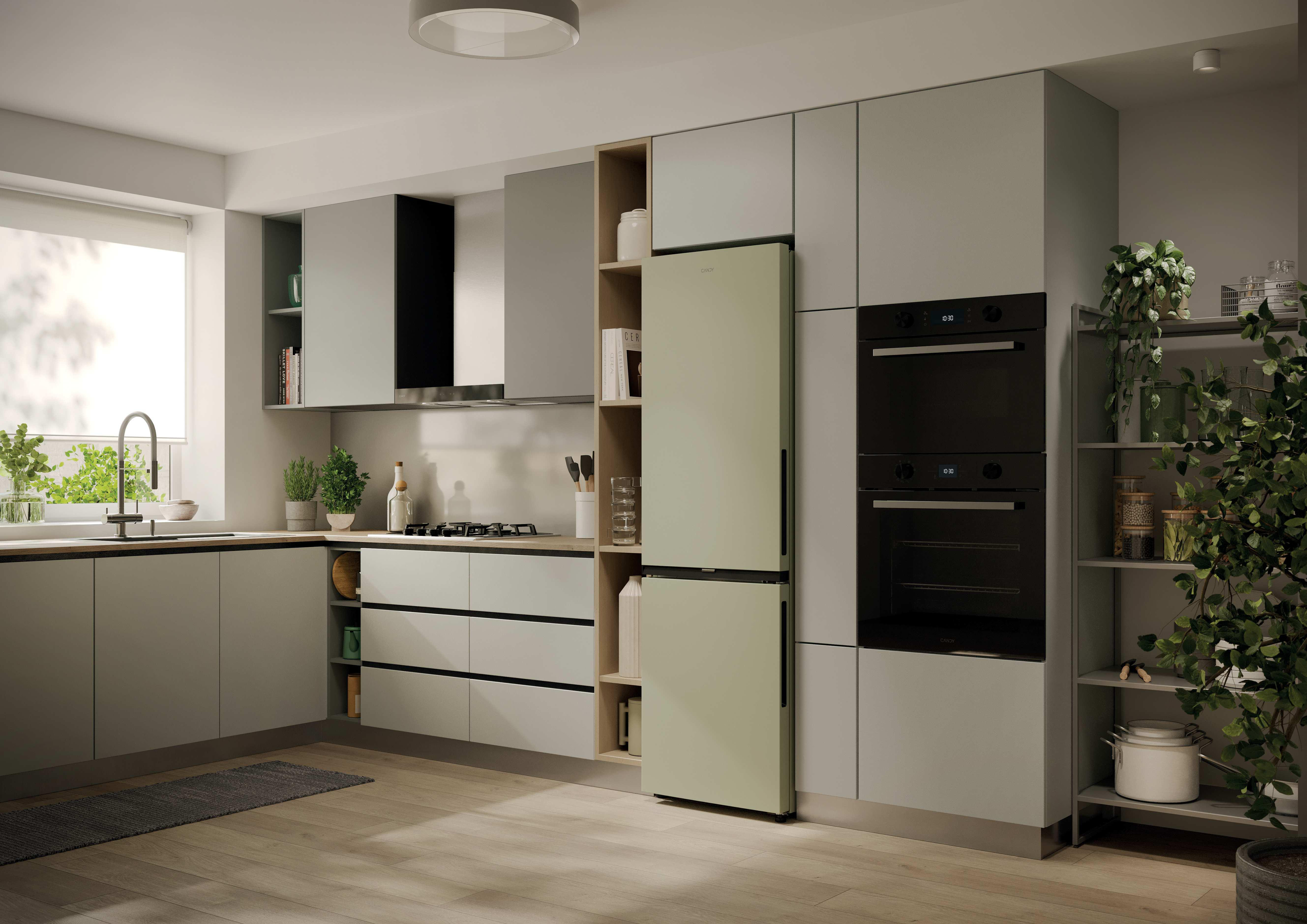 Eine moderne Küche mit hellgrauen Schränken, einem mintgrünen Kühlschrank und schwarzen Öfen.