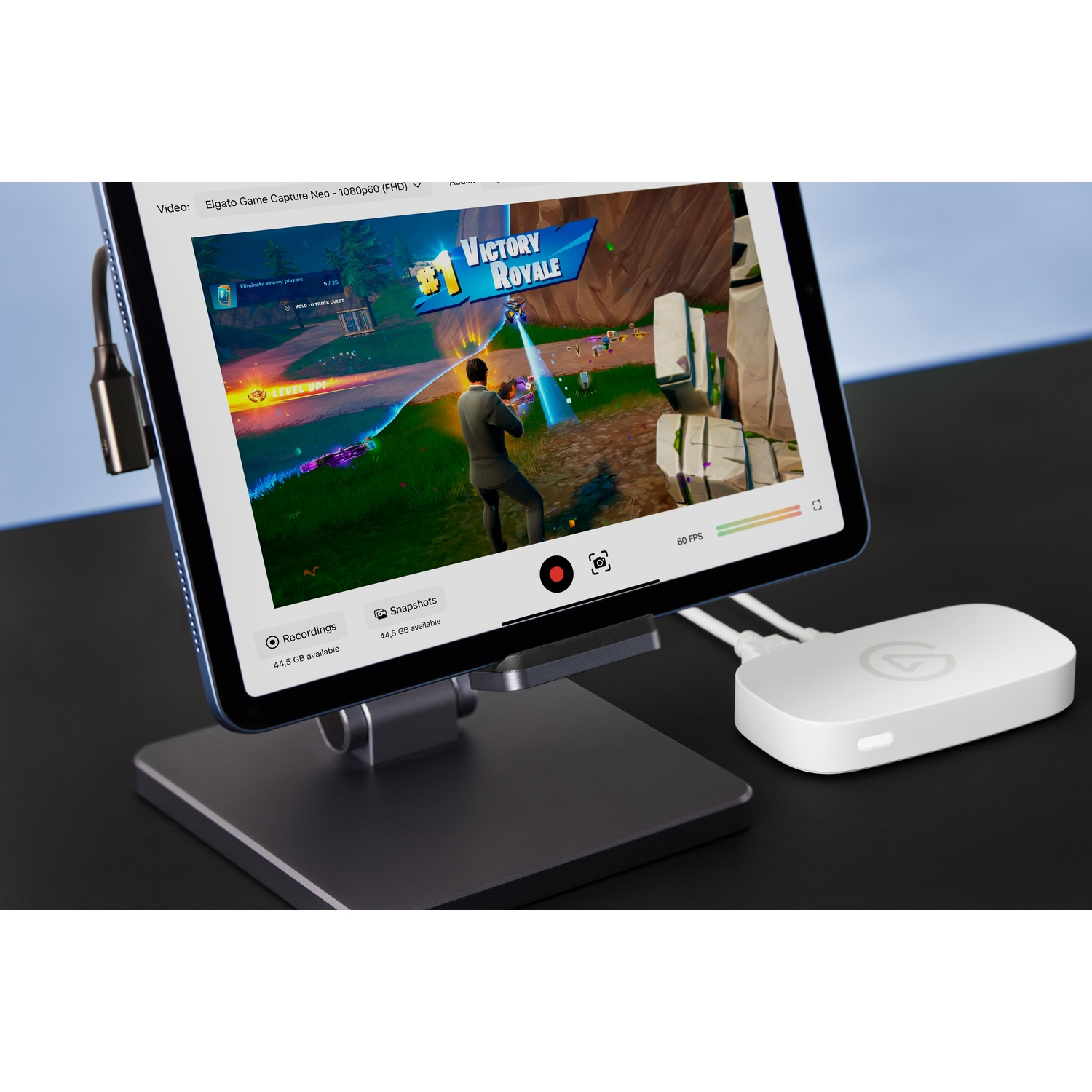 Tablet shows a video game with 