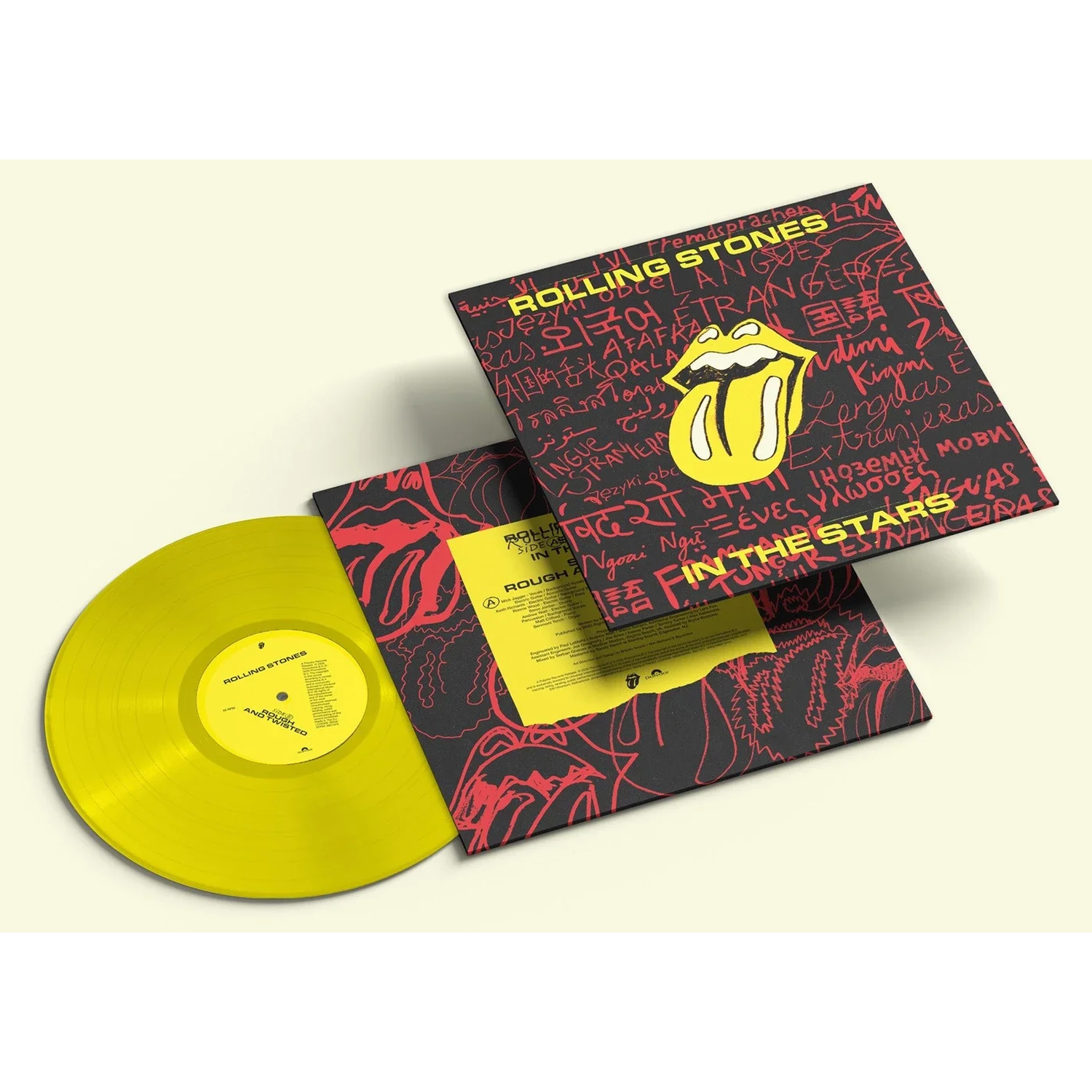 Gele Rolling Stones vinylplaat met zwarte hoes waarop 'Rolling Stones' in meerdere talen staat.