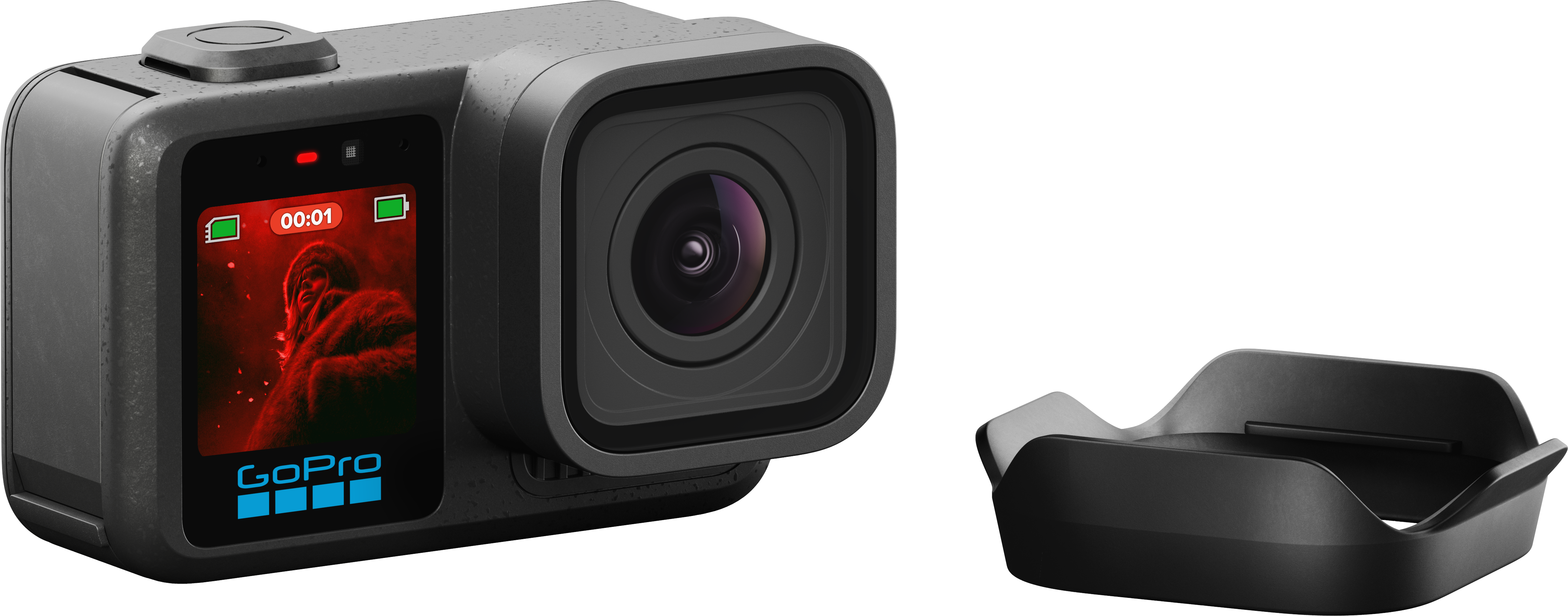GoPro grise avec écran rouge montrant un singe, avec un support de charge à côté.