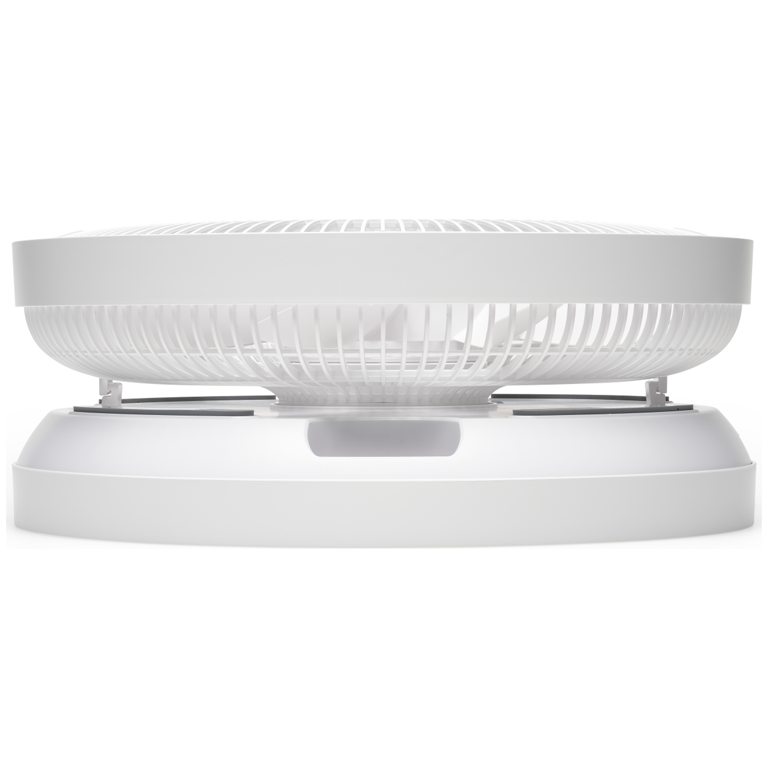 A white fan with a round base and a grille. Close-up view.