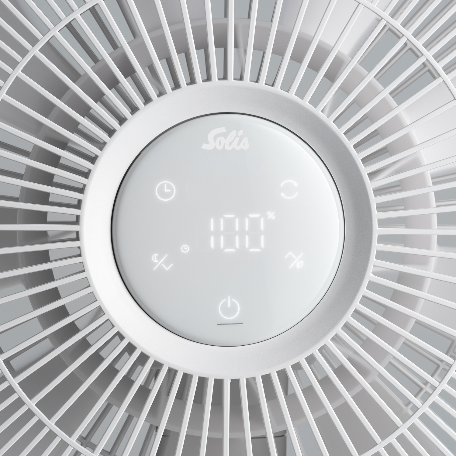 Close-up of a white fan with a digital display showing 100%.