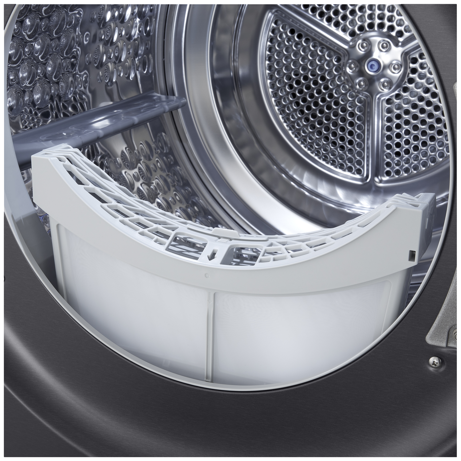 Interior view of a clothes dryer with lint filter and drum.