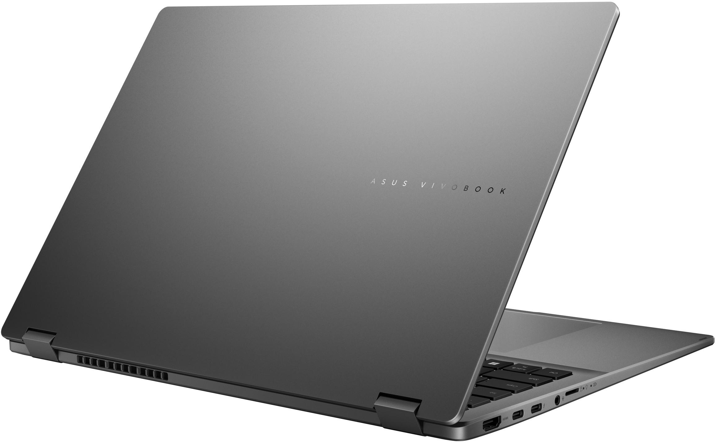 Egy szürke Asus Vivobook laptop látható hátulról ferde nézetből, nyitott képernyővel.