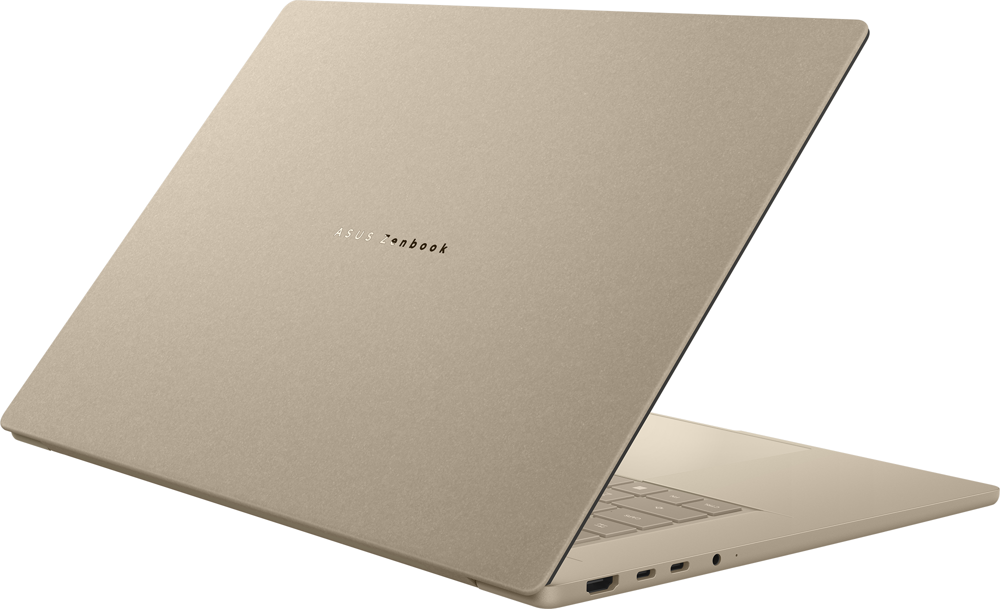Egy világos arany Asus Zenbook laptop nyitva van, látszik a billentyűzet része.