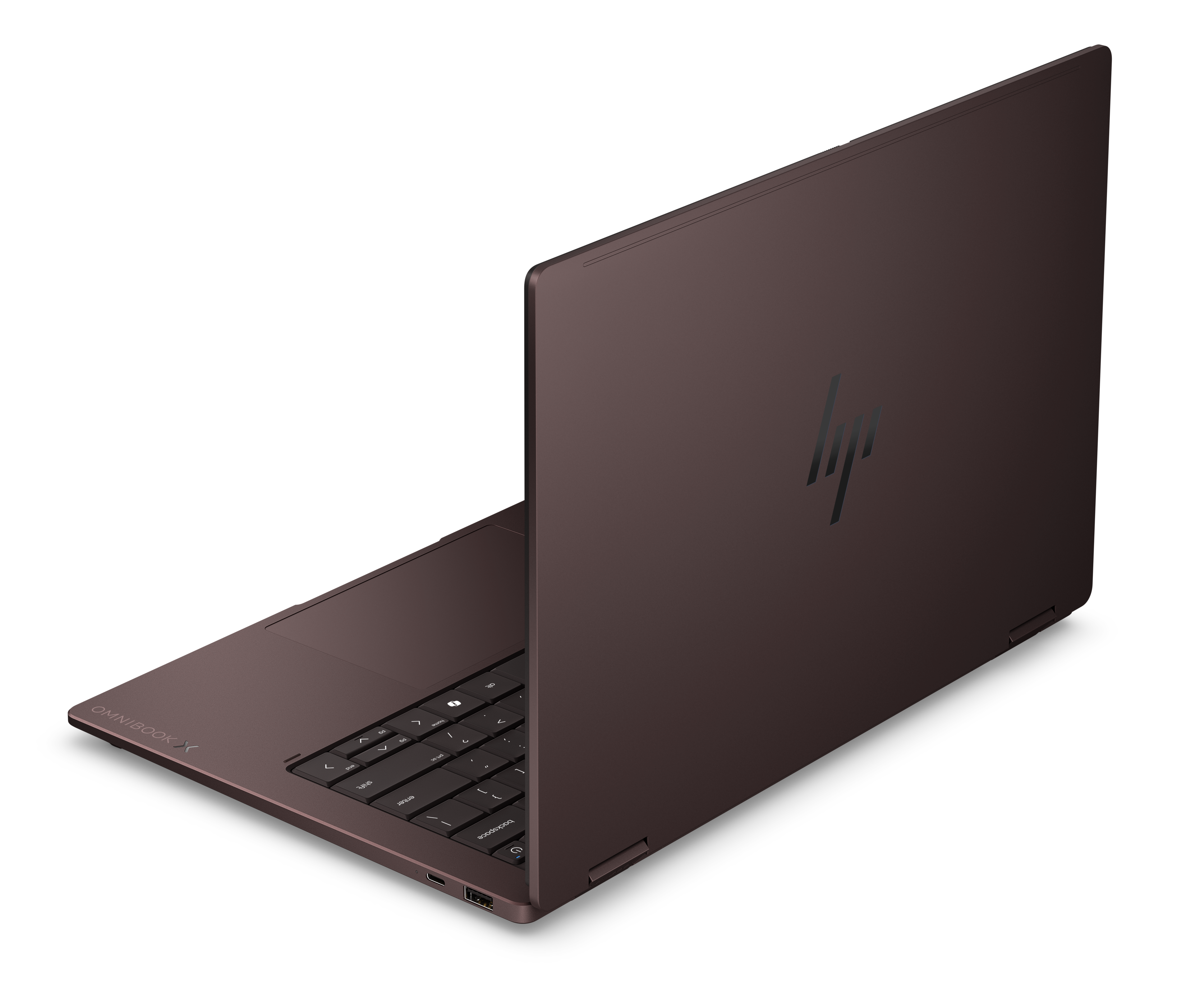 Zamknięty, brązowy laptop HP Omnibook X z czarną klawiaturą.