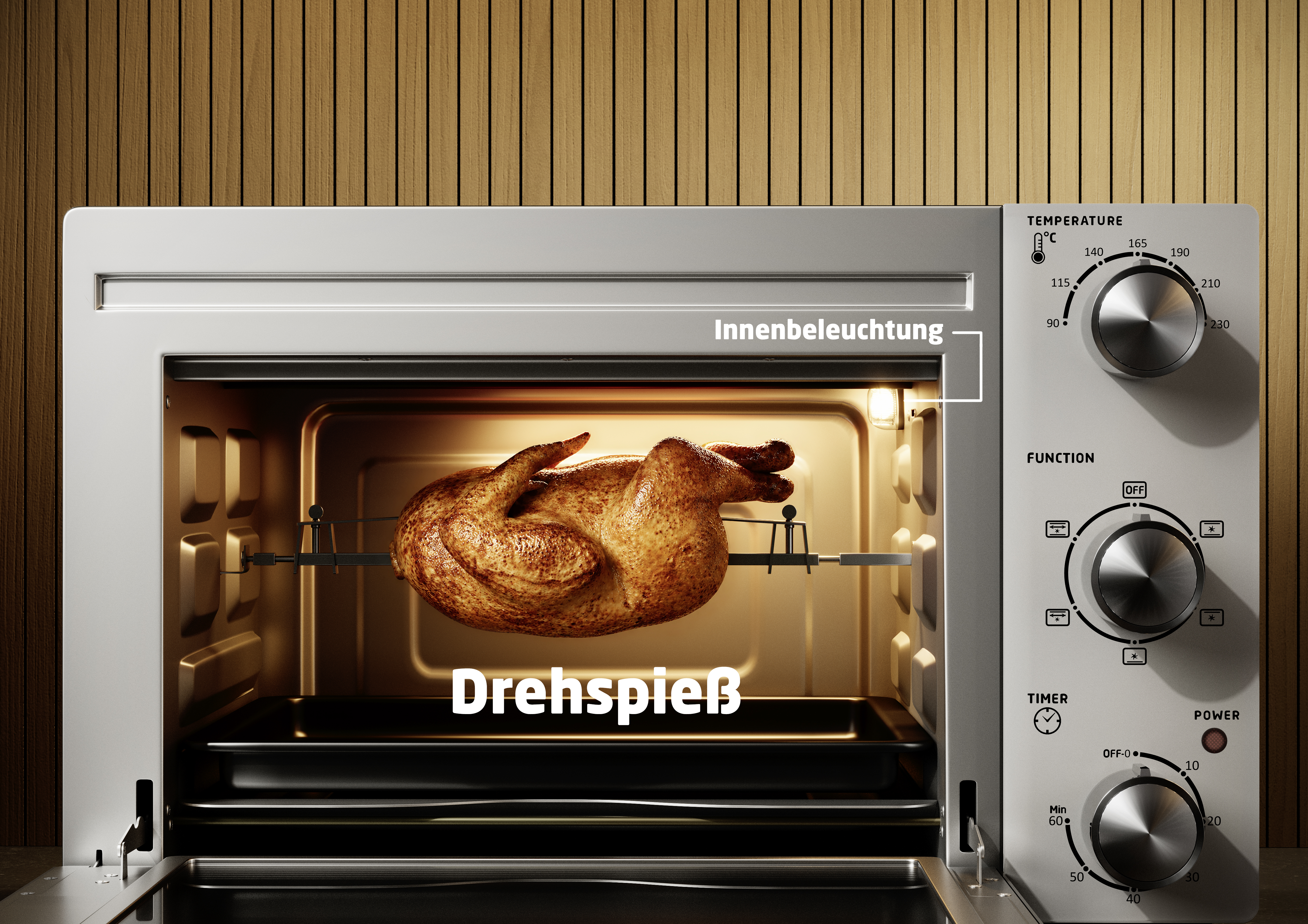 Ein goldbraunes Hähnchen brät auf einem Drehspieß in einem Ofen mit Innenbeleuchtung.