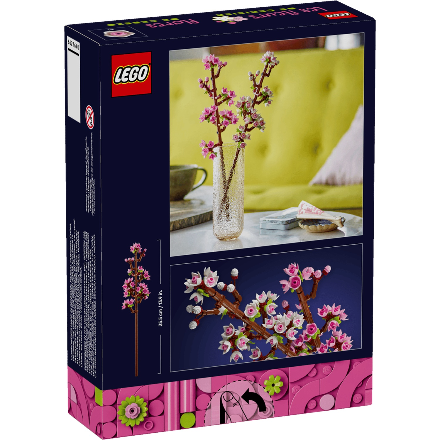 LEGO-doos met roze kersenbloesemtakken in een vaas en een model.