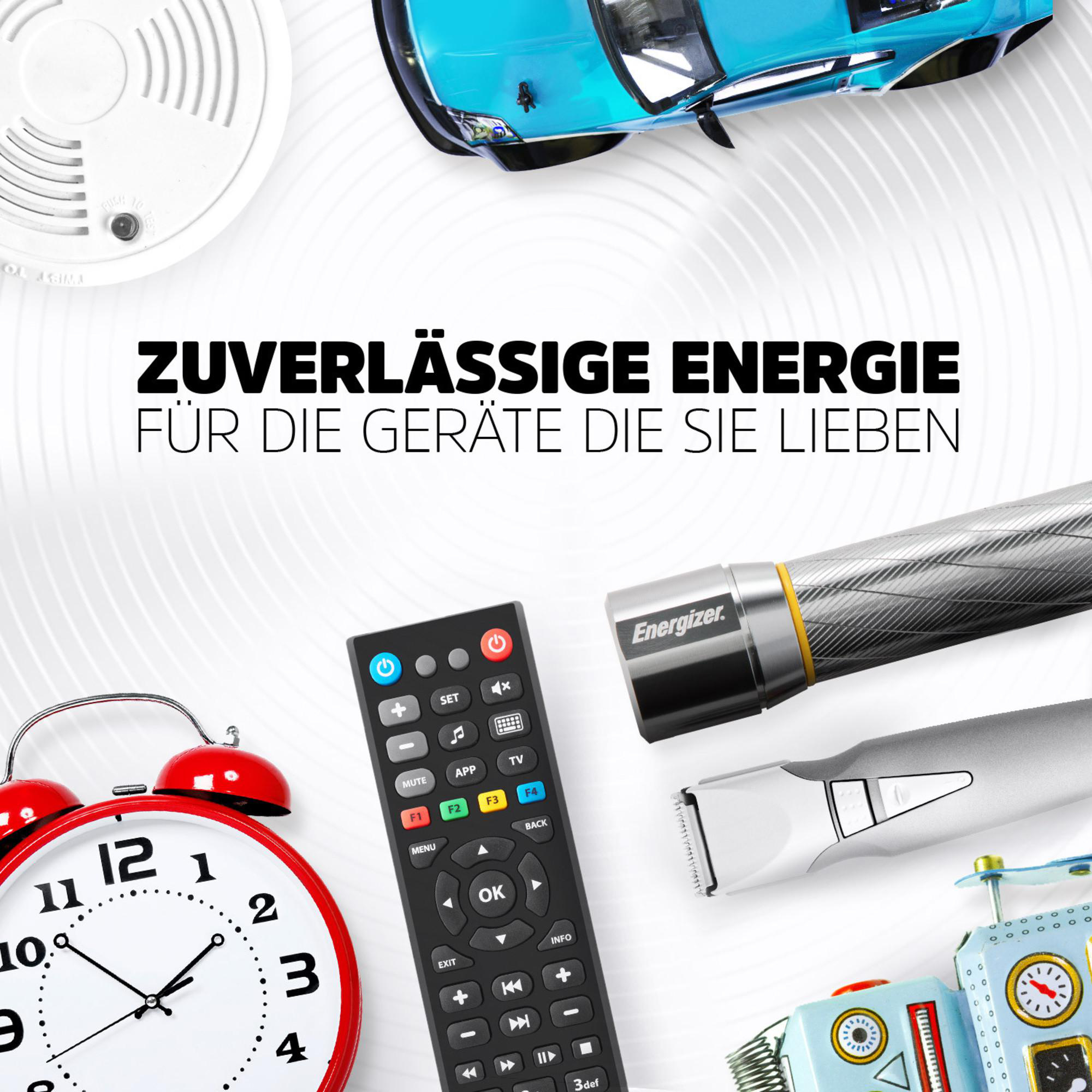 Ein Wecker, Fernbedienung, Trimmer, Taschenlampe, Roboter und blauer Rennwagen.