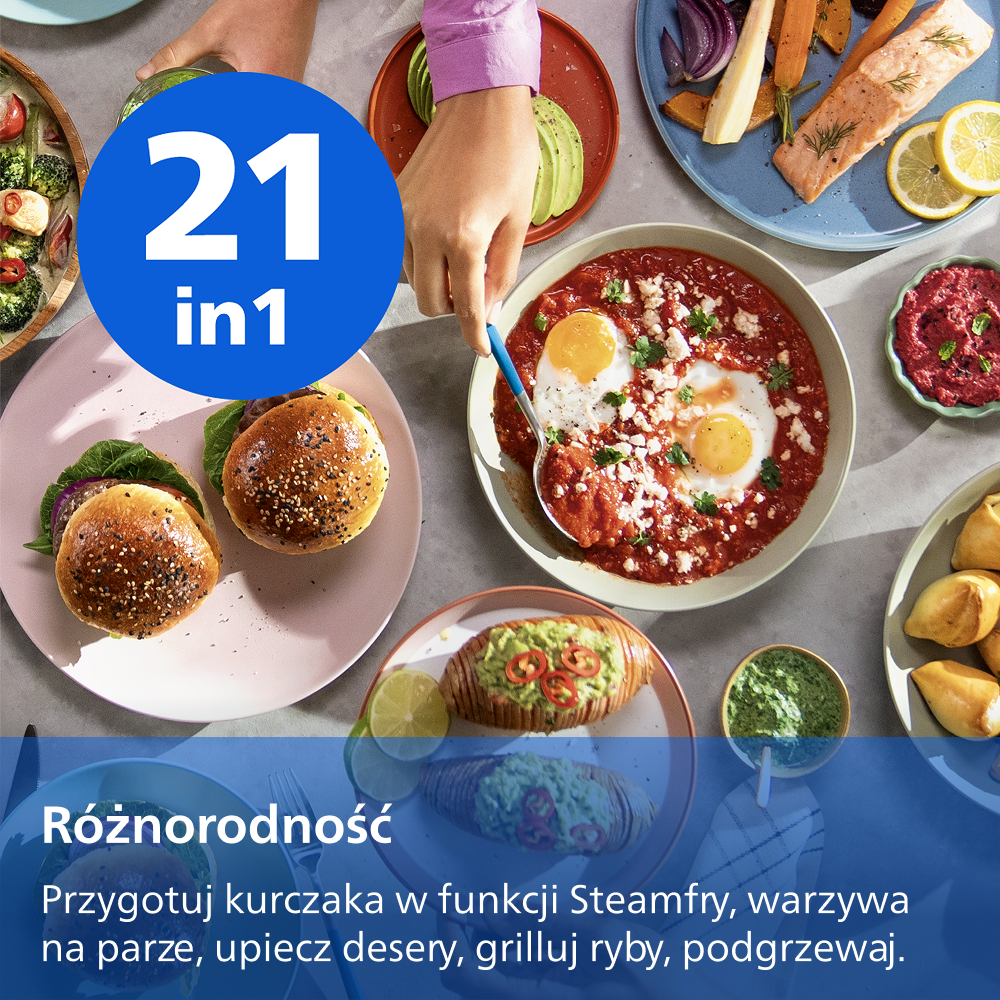 Stół z różnorodnymi daniami: burgery, łosoś, jajka w sosie, bataty.