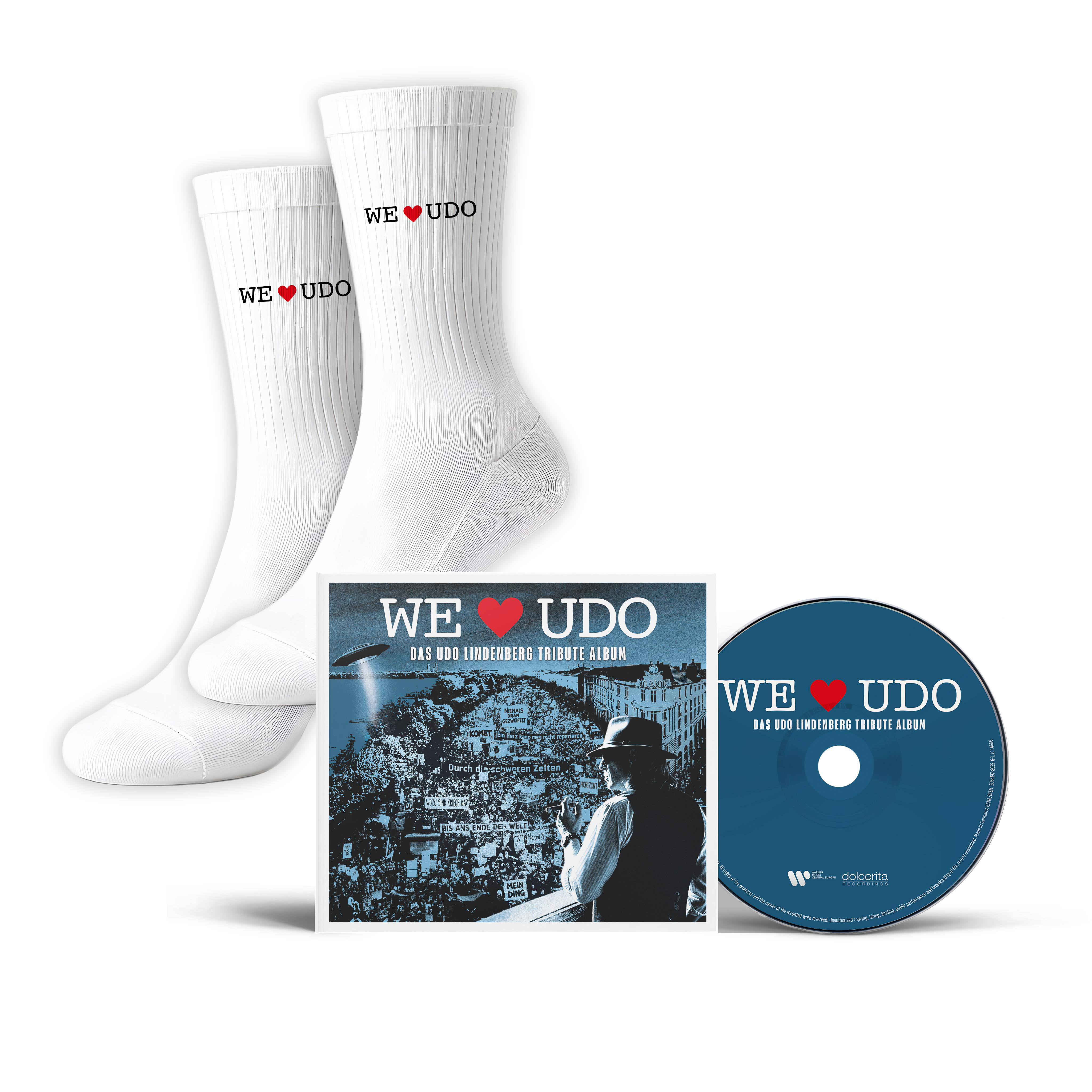 Weiße Socken und eine CD mit "WE UDO"-Logo und einem Bild einer Menschenmenge.