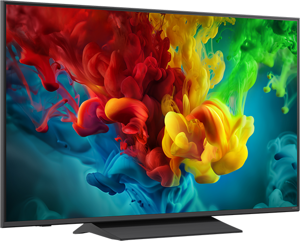 Egy TV képernyőn absztrakt, színes füstfelhők láthatók piros, sárga, zöld és kék színekben.
