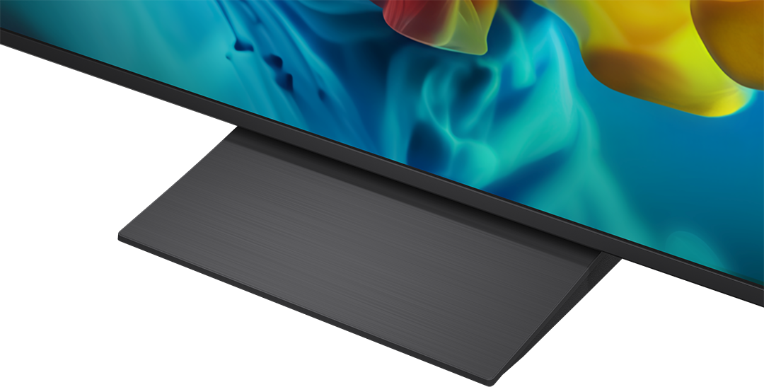 Egy fekete állvány tart egy modern TV-t színes, absztrakt háttérképpel.