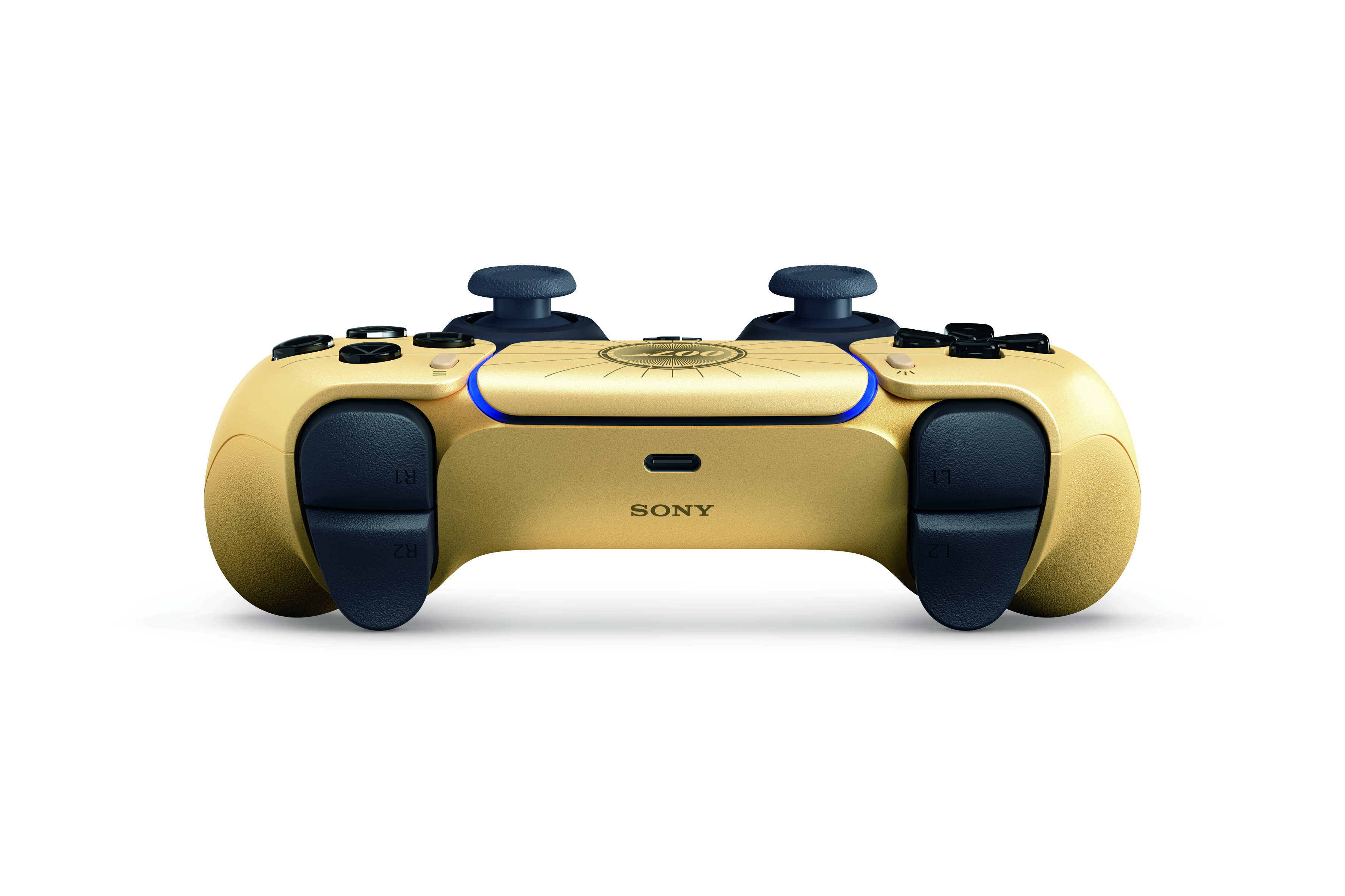 Siyah düğmeli ve kumandalı altın rengi Sony kontrolcü.