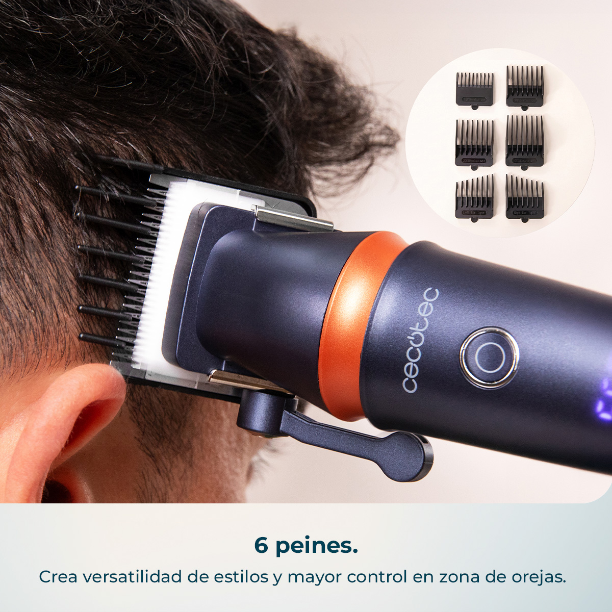 Una cortadora de pelo oscura con detalle naranja corta pelo oscuro. Seis peines expuestos.