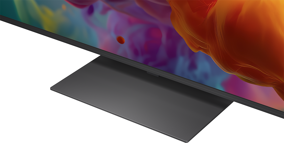 Szürke állvány tart egy modern TV-t színes háttérrel.