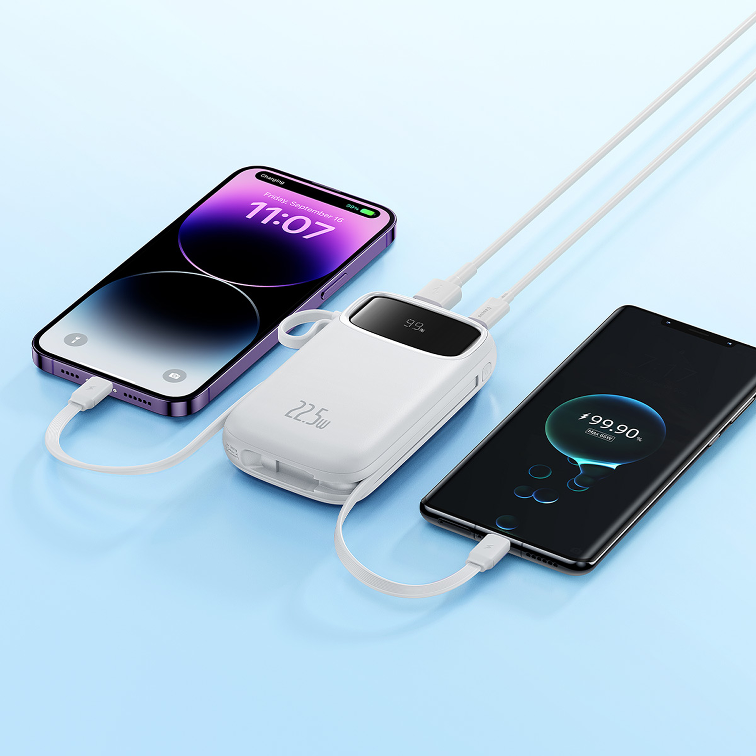 Un power bank blanco carga dos teléfonos inteligentes, uno morado, uno negro.