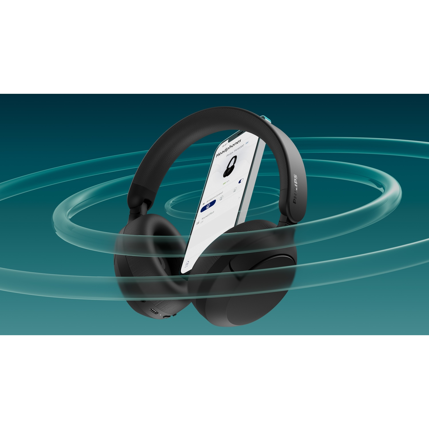 Cuffie nere con app su smartphone, circondate da anelli turchesi.