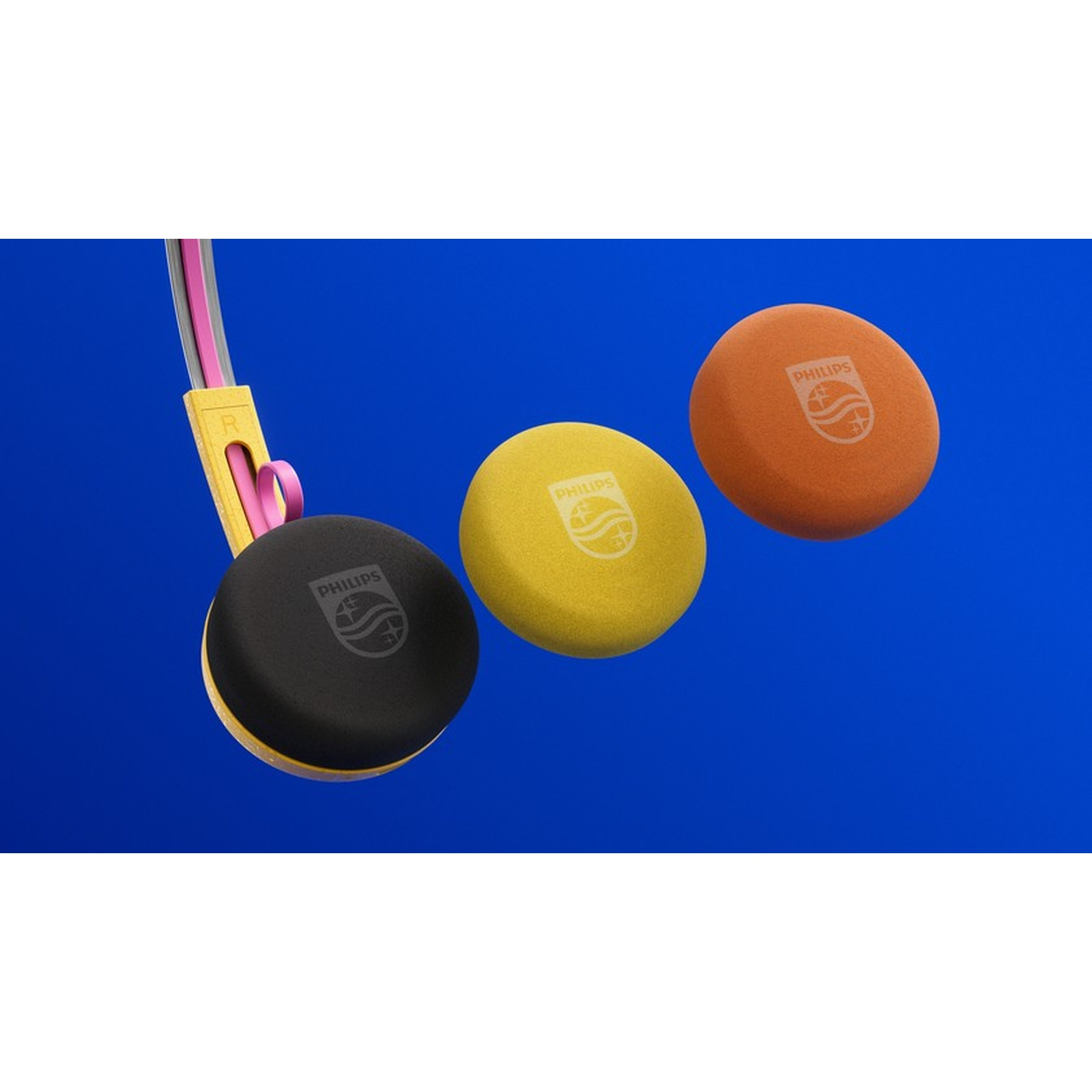 Tre cuscinetti Philips neri, gialli e arancioni su sfondo blu.