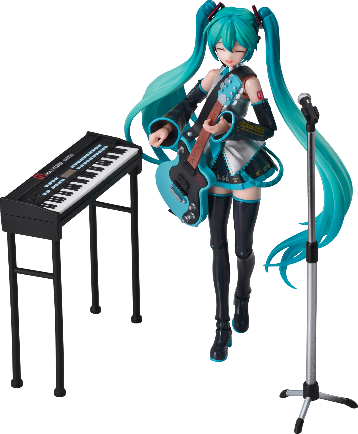 Una figura de Hatsune Miku toca la guitarra junto a un teclado y micrófono.