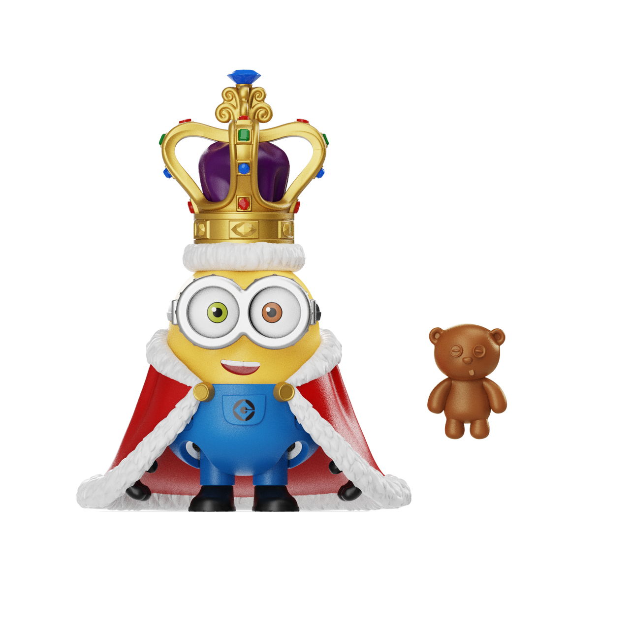 Un Minion vestido de rey con corona y capa de armiño roja, junto a un osito de peluche marrón.