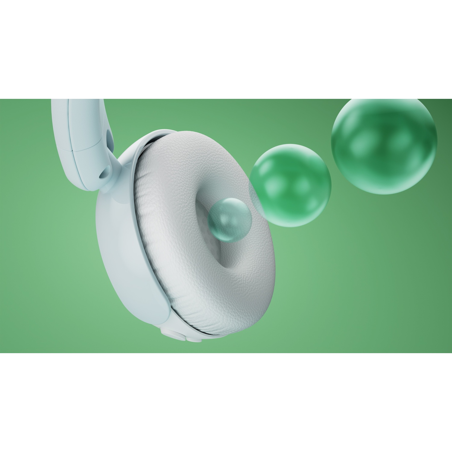 Cuffie azzurro chiaro con padiglioni bianchi su sfondo verde con tre sfere.