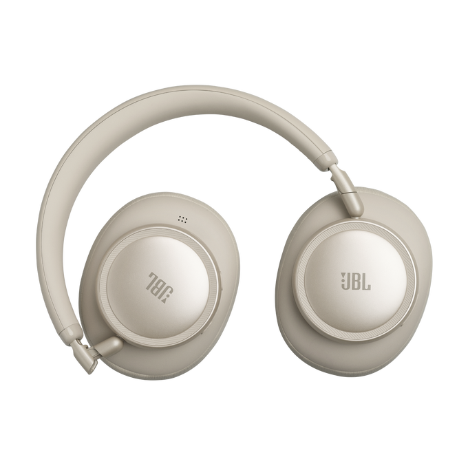 Auriculares JBL beige con almohadillas redondas y anillo plateado.