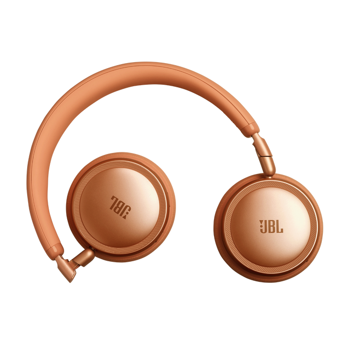 Auriculares JBL naranjas con diadema y almohadillas, sobre fondo negro.