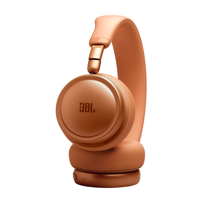 Unos auriculares JBL naranjas con diadema y almohadillas.