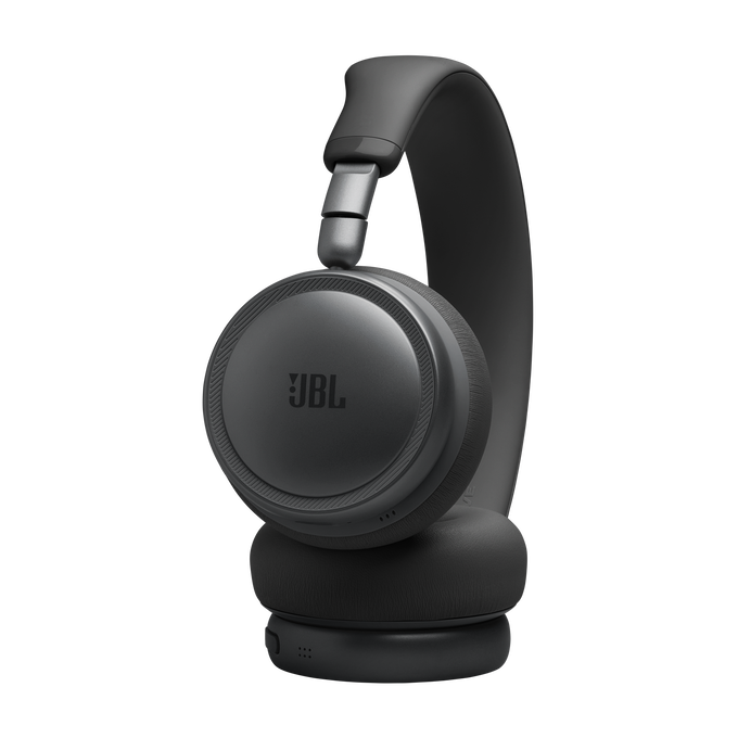 Auriculares JBL negros con almohadillas acolchadas y diadema ajustable en fondo negro.