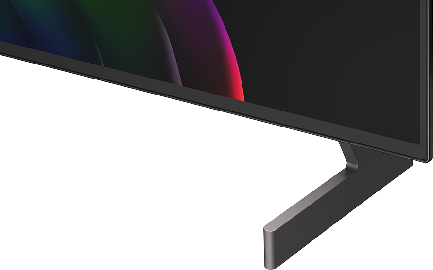 Modern TV közelképe elegáns szürke állvánnyal és színes háttérrel.