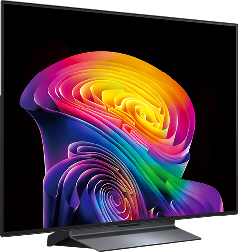 Egy modern TV szivárvány színek vibráló, örvénylő absztrakt művészetét jeleníti meg fekete háttéren.