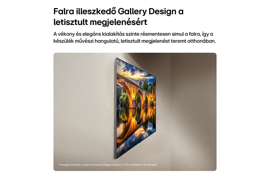 Egy vékony TV falra szerelve, kőhíddal folyó felett.