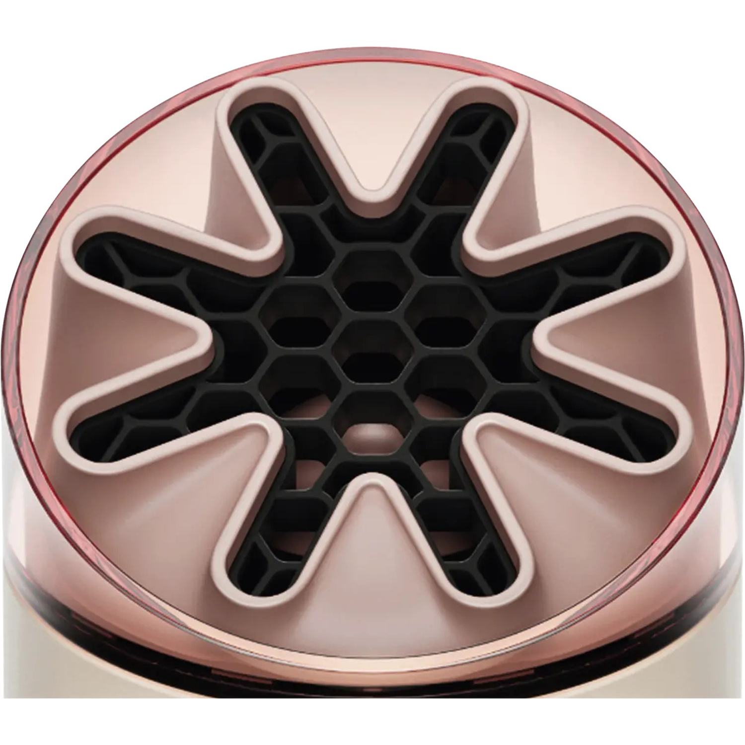 Close-up of a hair dryer diffuser with a star-shaped core and hexagonal openings.