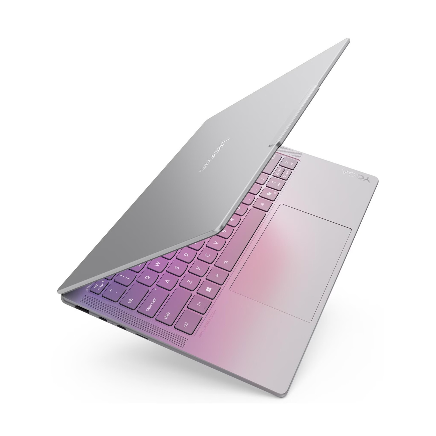 Un laptop argento con tastiera sfumata dal viola al rosa.