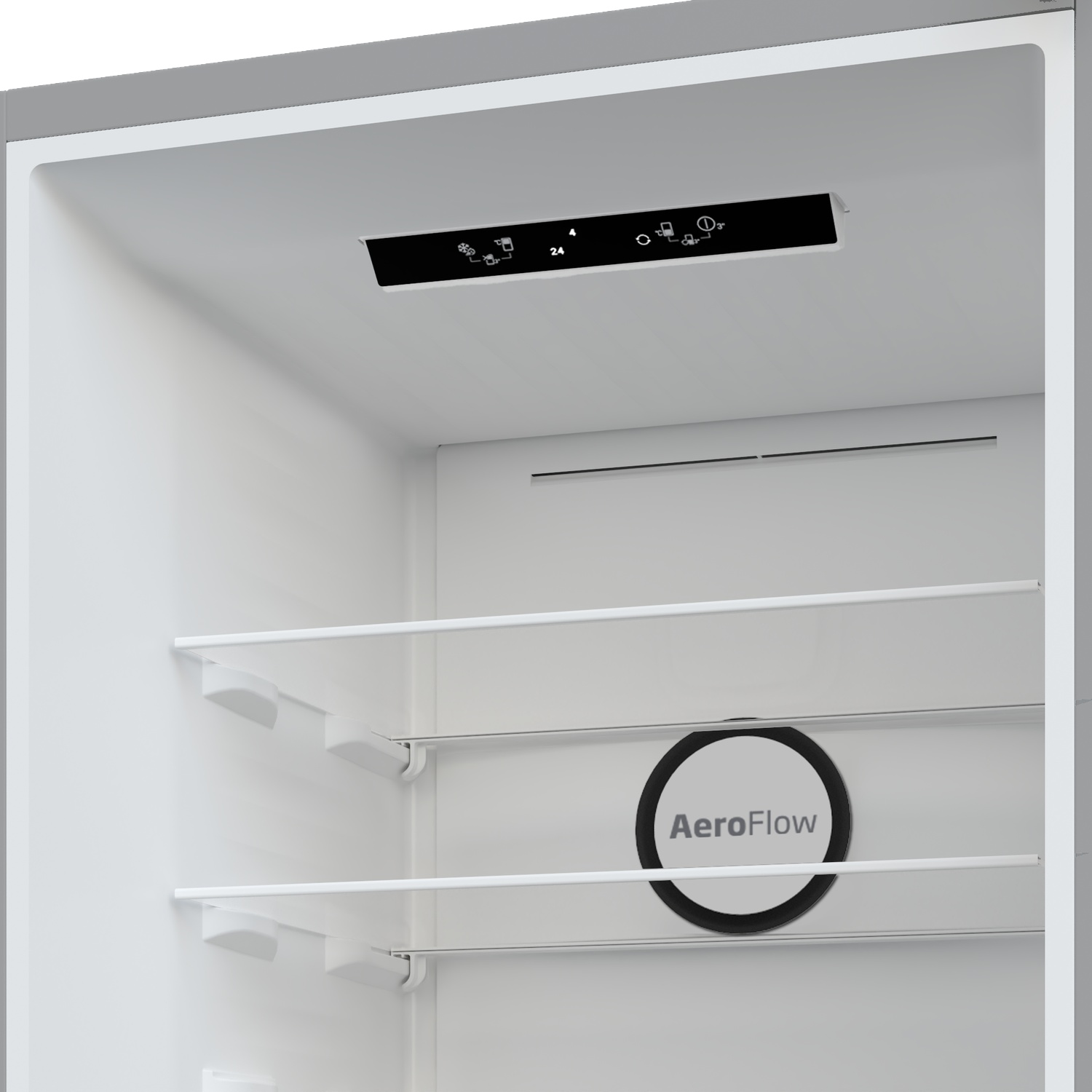 Intérieur d'un réfrigérateur avec commandes numériques et ventilation.