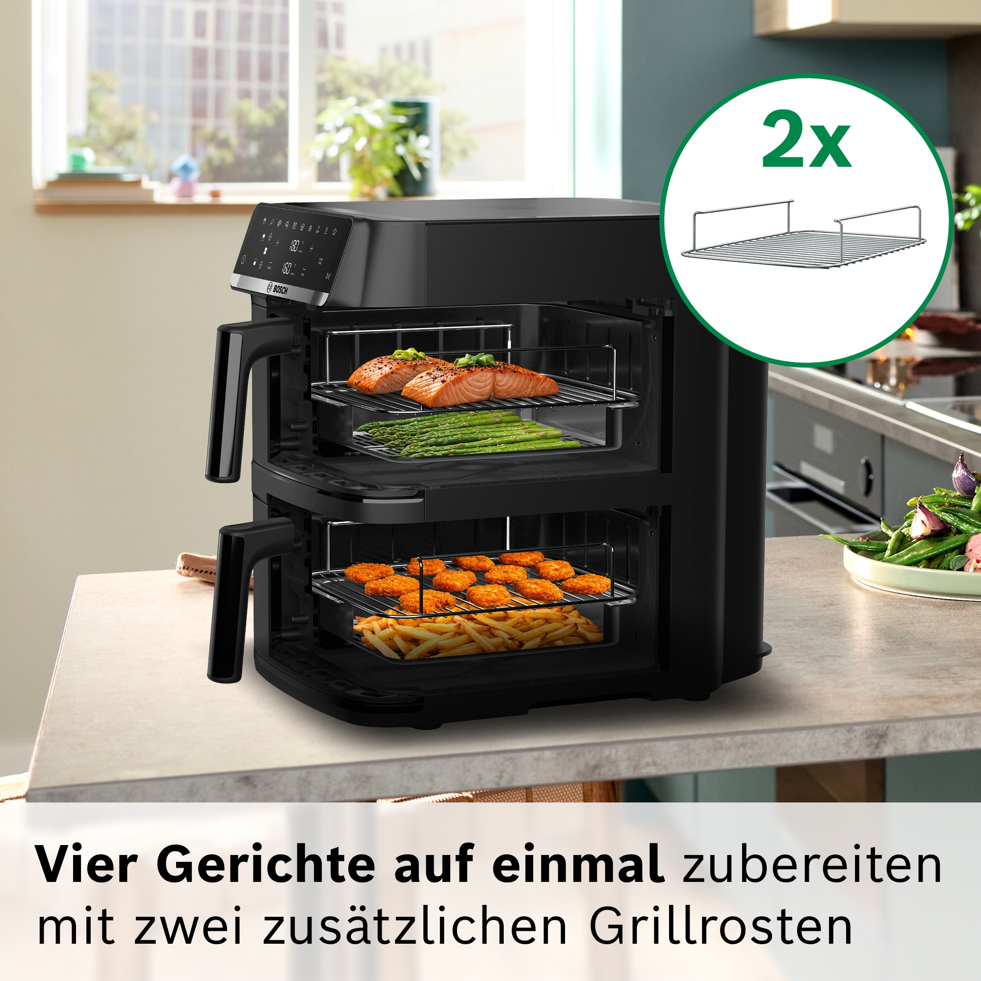 Ein schwarzer Bosch Heißluftfritteuse mit zwei Schubladen, gefüllt mit Lachs, Spargel, Nuggets und Pommes.