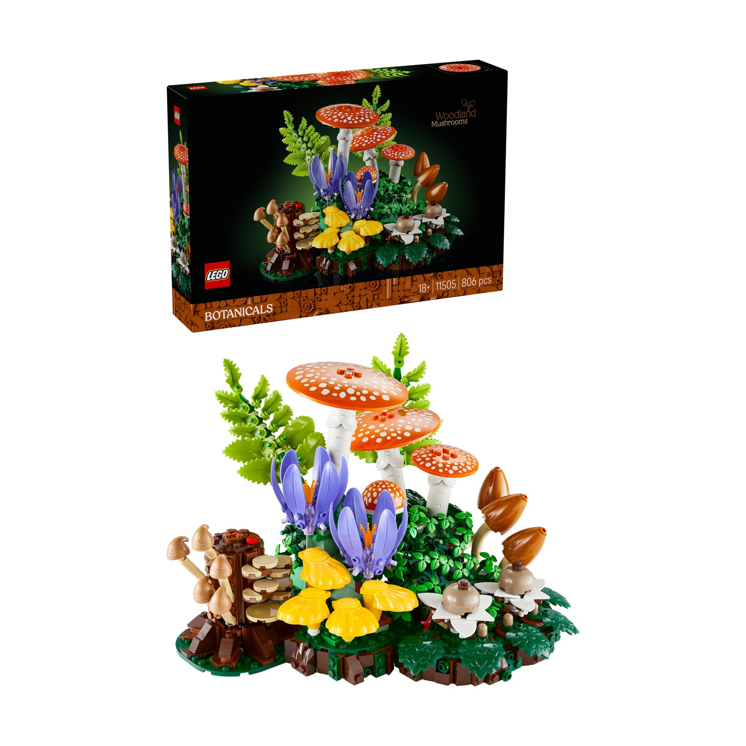 Un modello Lego di funghi amanita muscaria, felci e fiori viola su base verde.