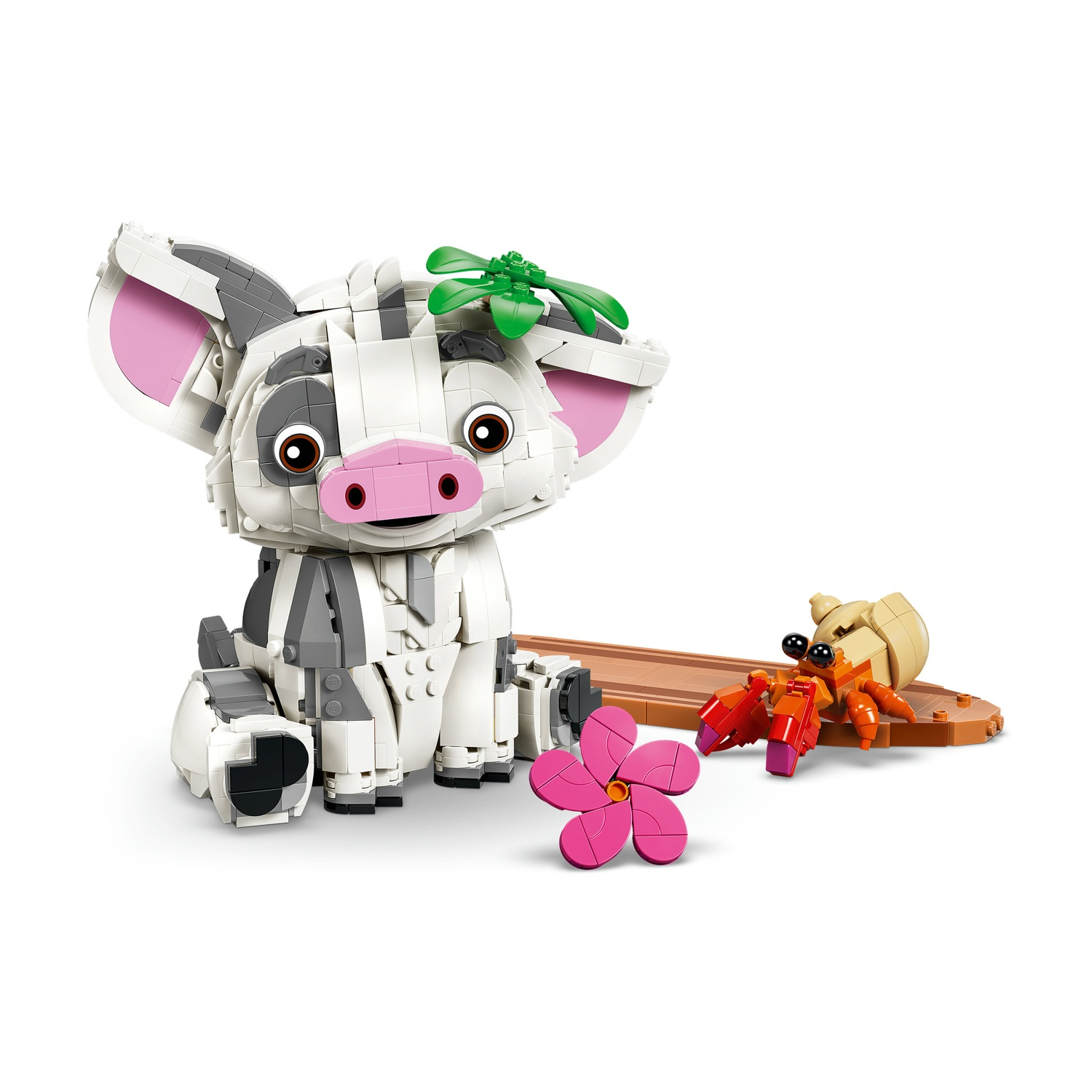Un maiale Lego siede accanto a un paguro eremita Lego e un fiore.