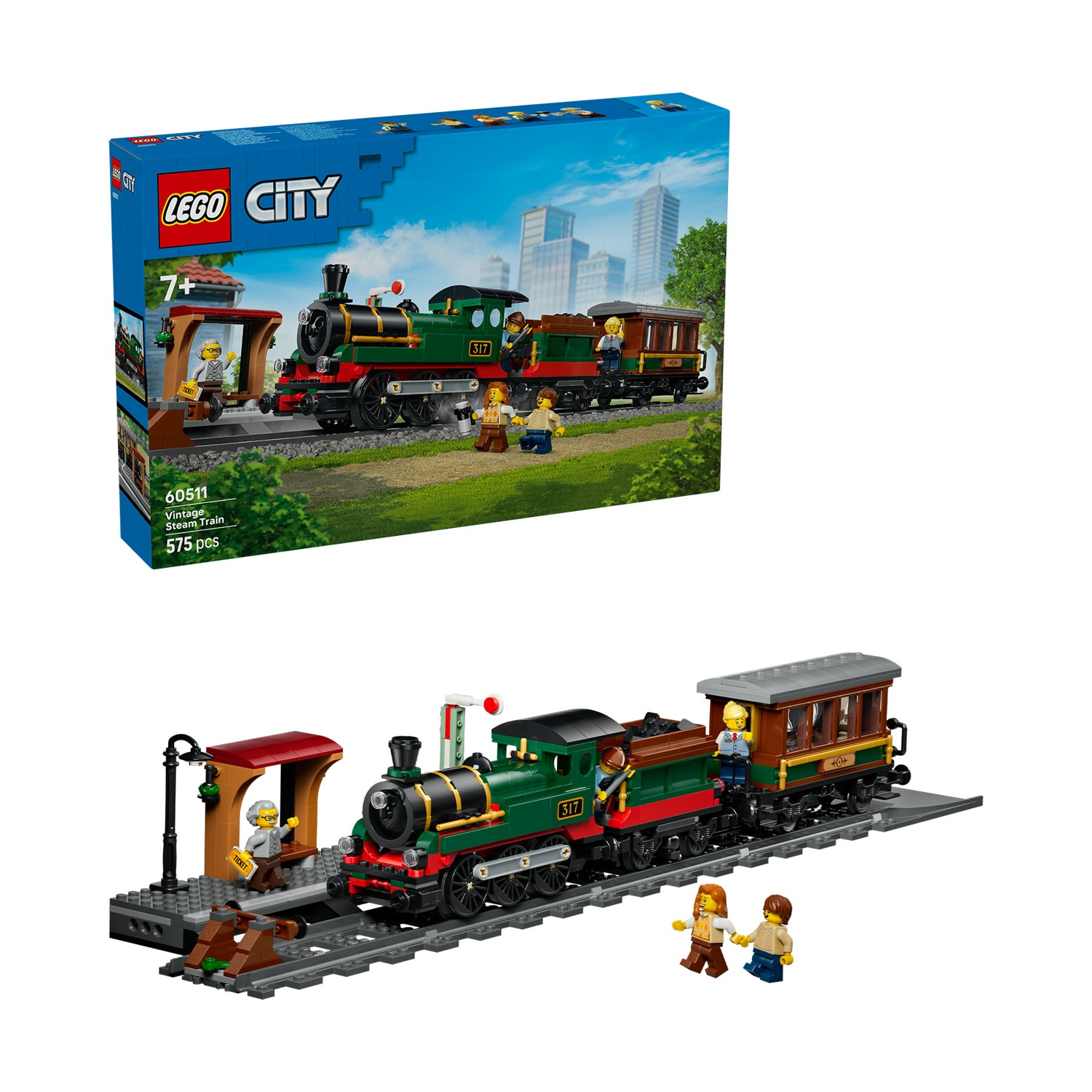 Un treno a vapore Lego verde con carrozze e figure in una stazione.