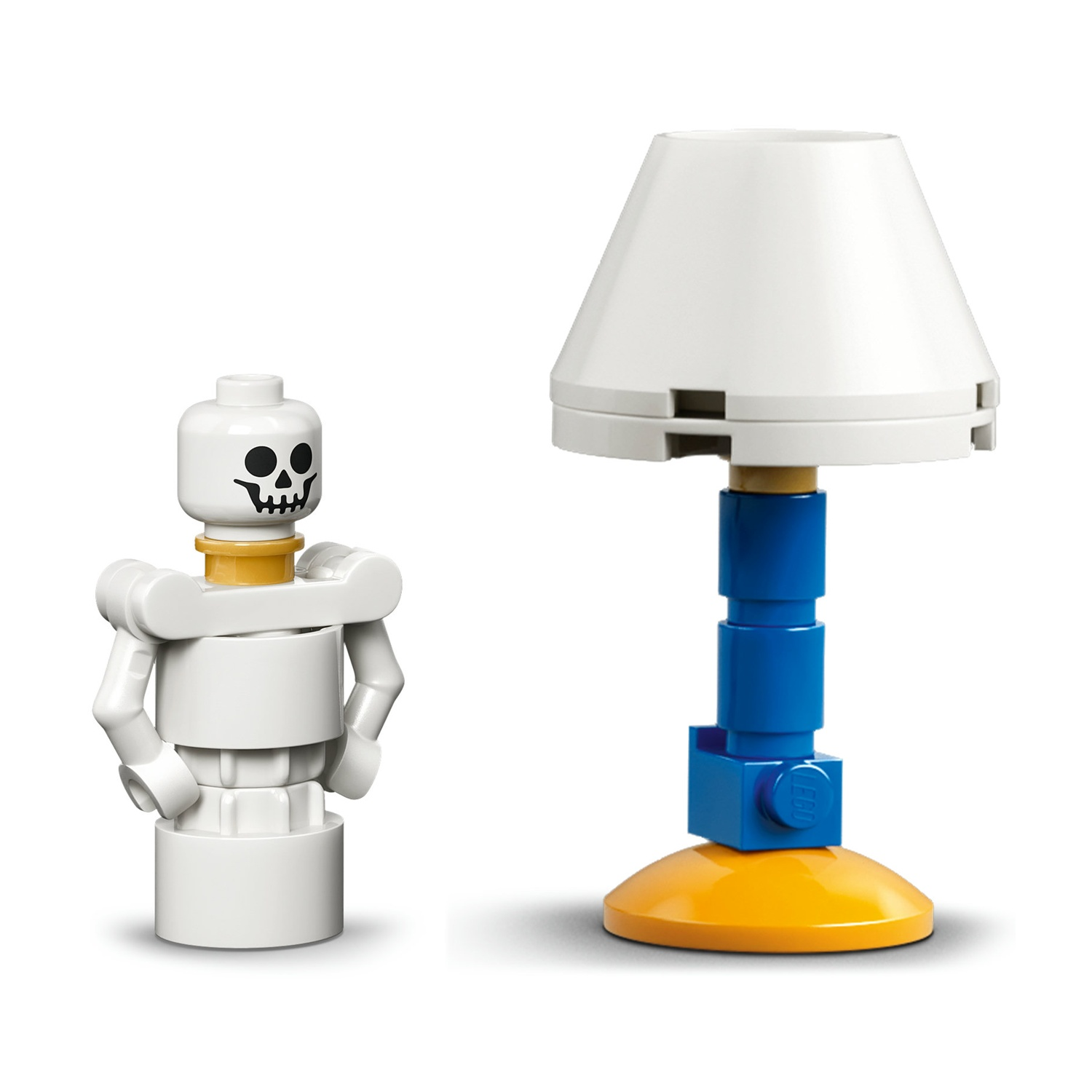 Una testa di minifigure scheletro bianca e una lampada da tavolo blu/gialla.