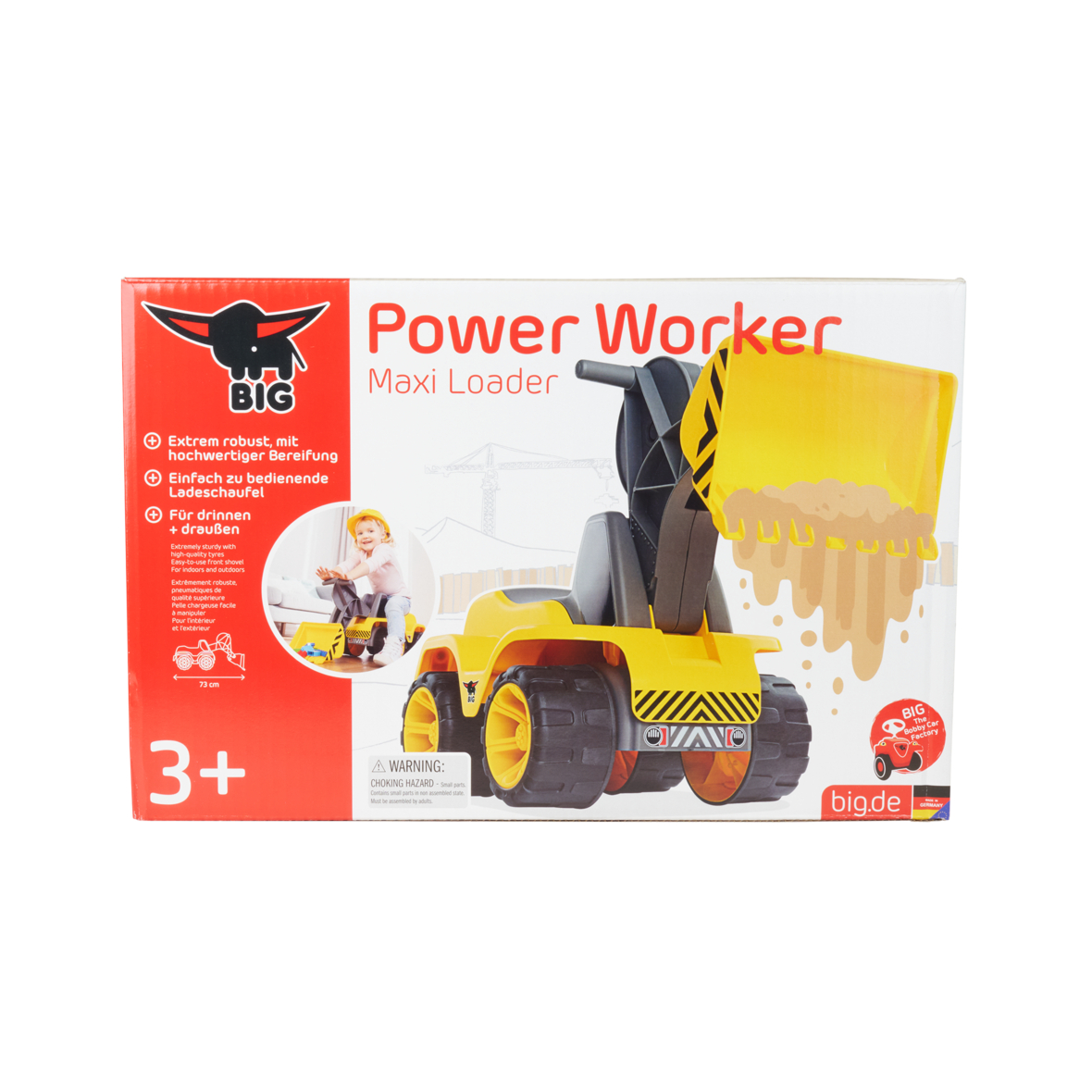 Verpackung eines gelben und schwarzen Power Worker Maxi Loaders mit einem Kind, das darauf sitzt.