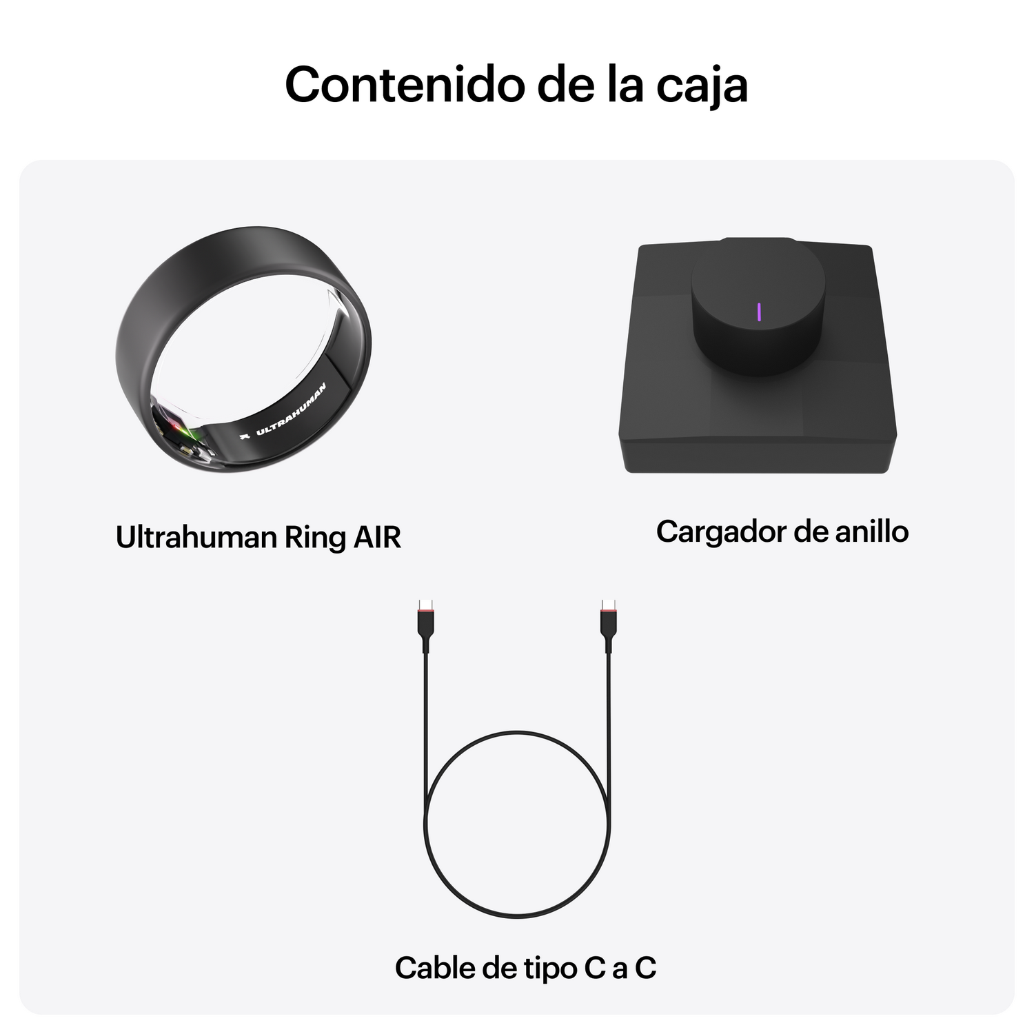 Un anillo negro, un cargador y un cable USB-C se muestran sobre fondo blanco.