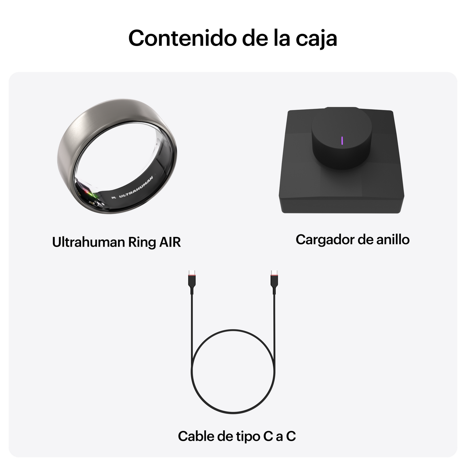 Un anillo plateado, una base de carga negra y un cable USB-C.