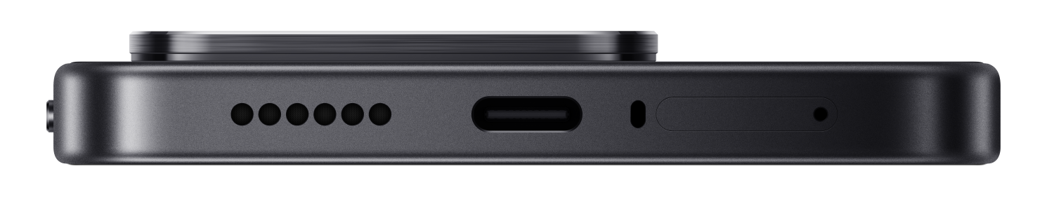 Zbliżenie dolnej części ciemnego smartfona z portem USB-C i grillem głośnika.