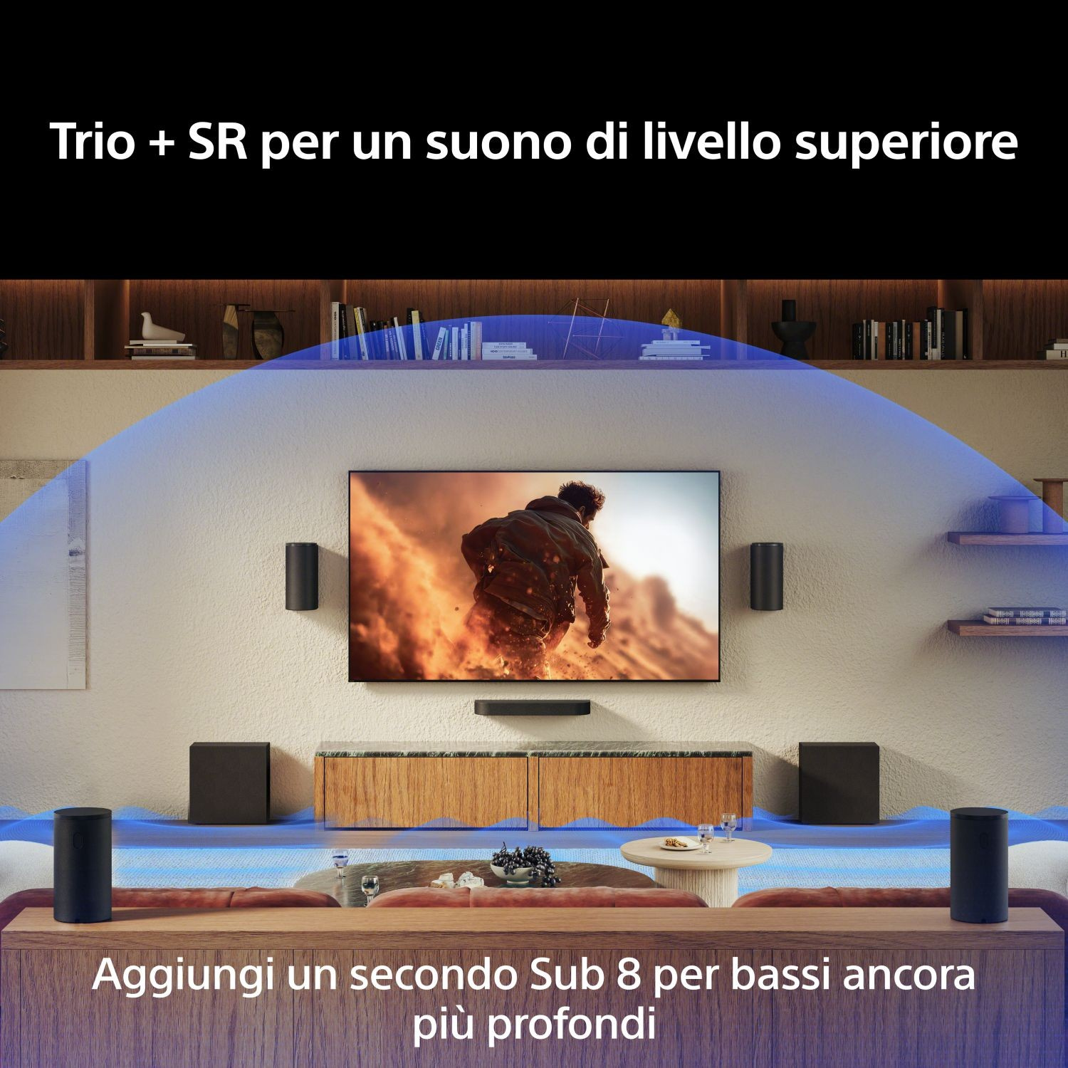 Soggiorno con TV, altoparlanti e subwoofer.