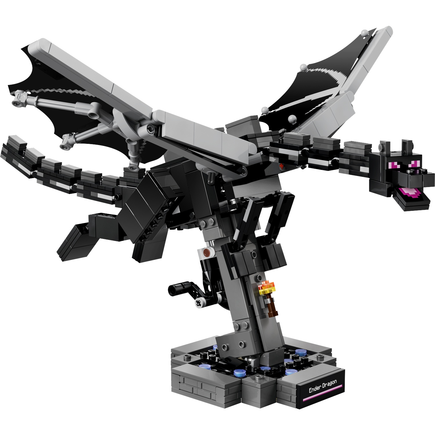 Un Lego Ender Dragon noir avec des ailes et des yeux violets sur une base grise.