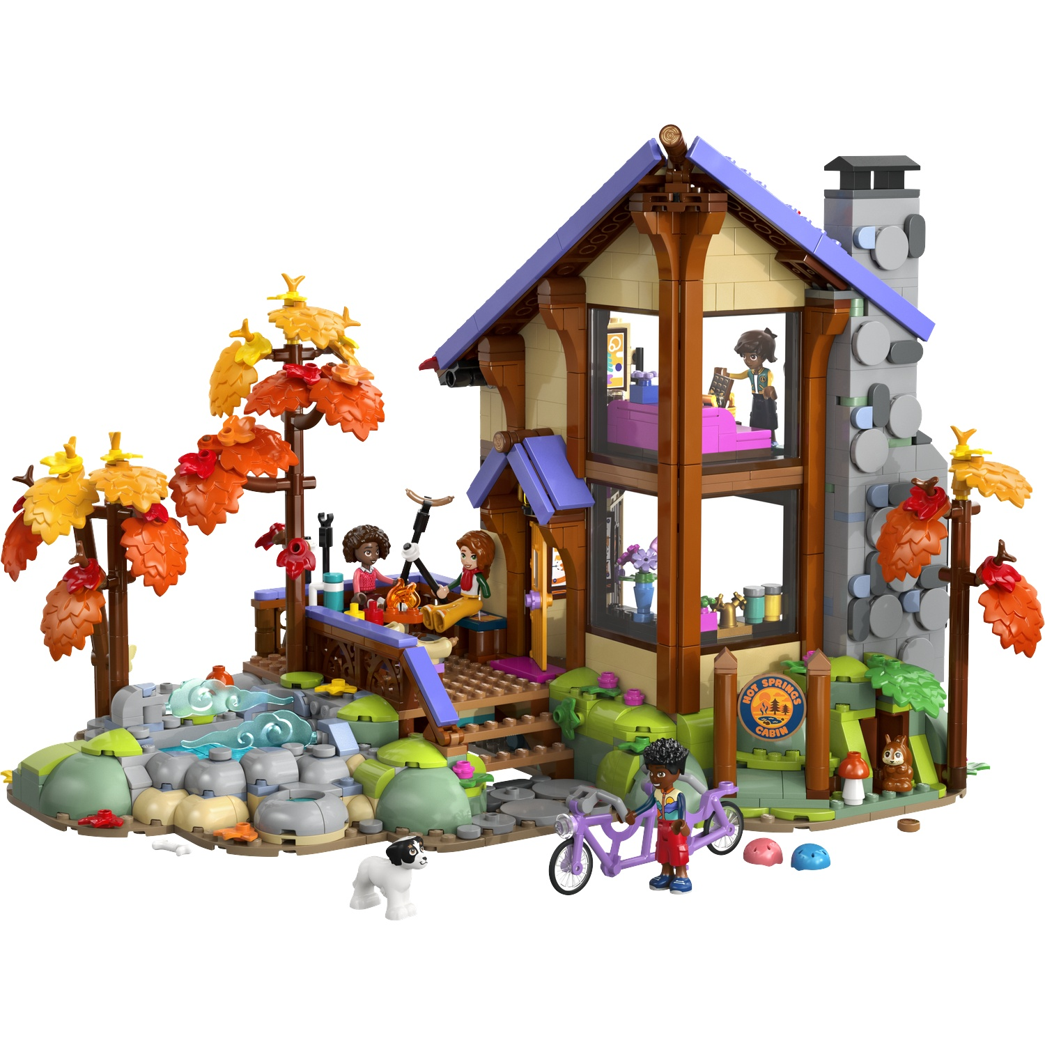 A Lego house with autumn trees, a pond, bikers, and a dog.