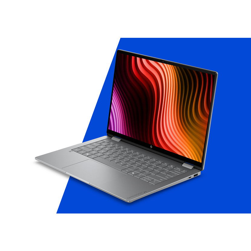 Ein silberner Laptop mit einem bunten, gewellten Hintergrund auf blau-weißem Grund.