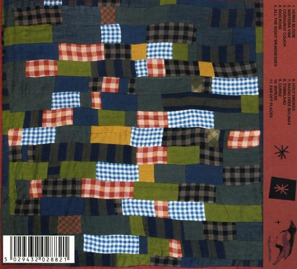Patchwork-Decke mit Songliste und Barcode.